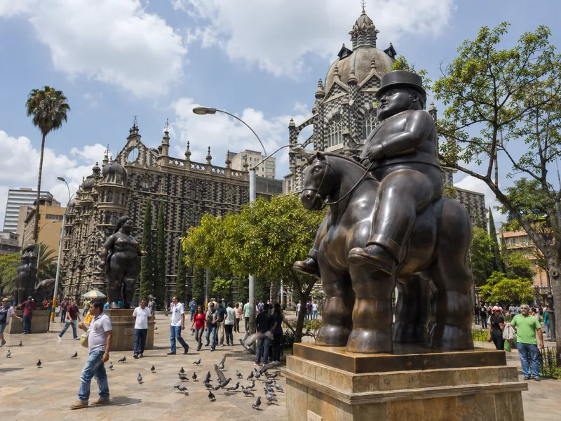 Botero bronze sculptures in Plaza Botero with Palacio de la Cultura behind