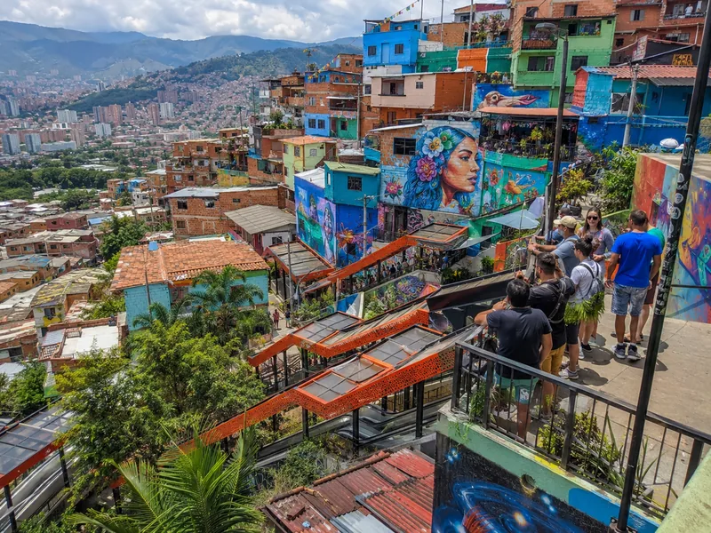Outdoor escalators and colorful murals of Comuna 13 in Medellín